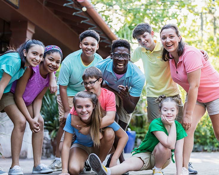 Photo of happy children and adults outside
