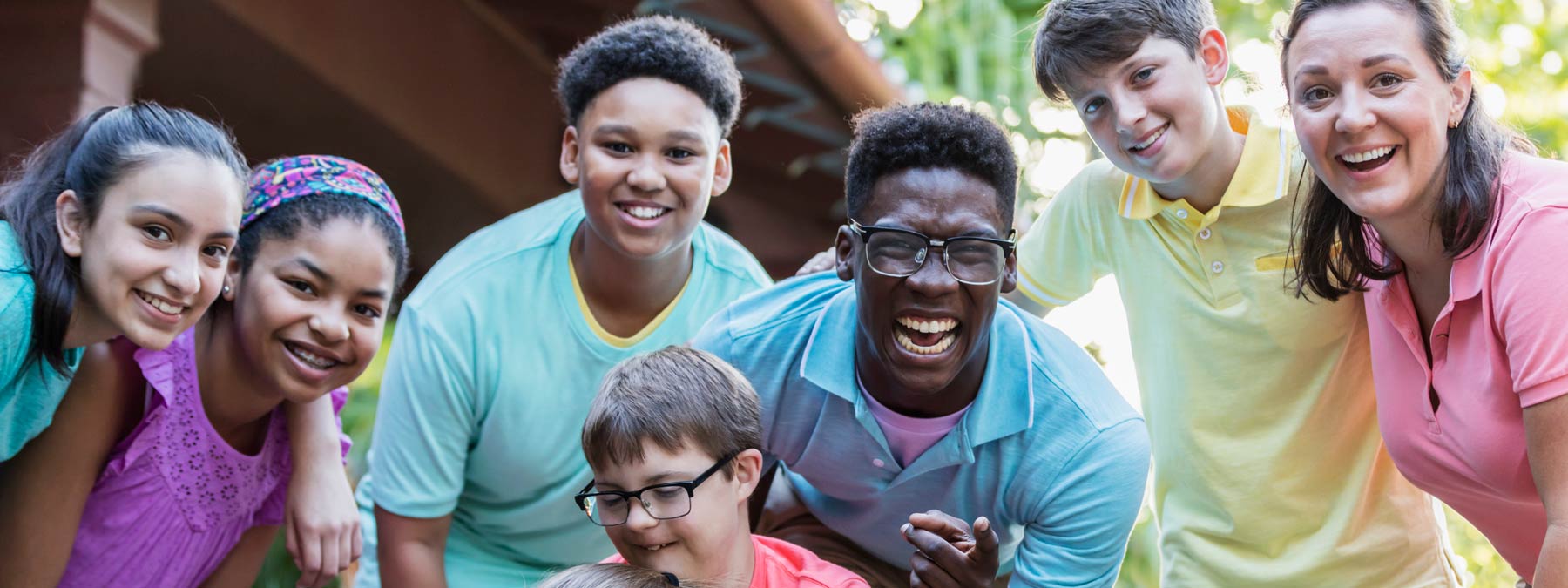 Photo of happy children and adults outside