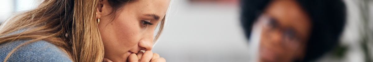A woman receives counseling services in an office setting.