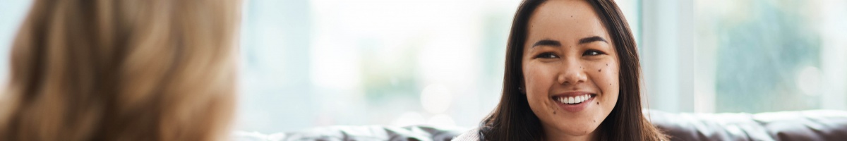 A woman receives counseling support in an office setting.